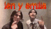two men standing next to each other with the words len y emilia written in red
