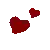 two red hearts are floating in the air in a pixel art style .