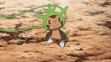 a cartoon character with a green hat and leaves on its head