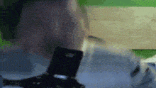 a blurry picture of a person holding a cell phone in their hand