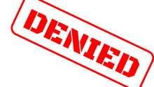 a red and white stamp that says denied on it