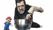 put in a pot ricky berwick in the pot making a mario cake mixing