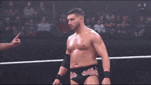 wrestlers in a ring with a sign that says ' i love you ' on it