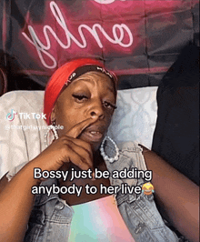 a woman with a red headband says bossy just be adding anybody to her live on tiktok