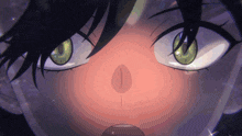 a close up of a person 's green eyes