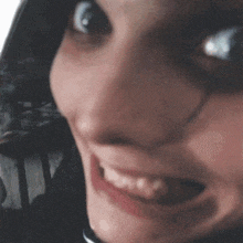 a close up of a woman 's face with a collar on