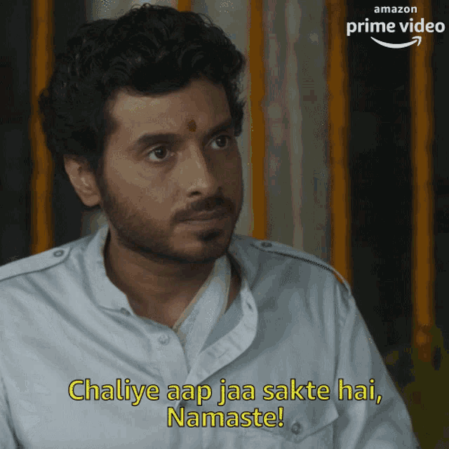 a man with a beard and a bindi on his forehead says chaliye aap jaa sakte hai namaste
