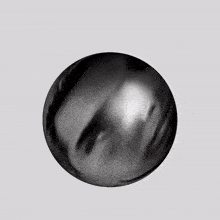 a black and white image of a sphere with a hole in the middle