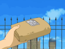 a person is holding a brown envelope with a sticker on it that says ' dhl ' on it