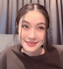 a close up of a woman 's face with her eyes closed