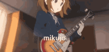 a girl in a school uniform is playing a guitar and the word mikujo is on the bottom right