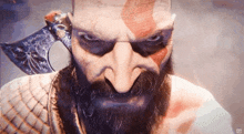 a close up of a man with a beard holding a sword .