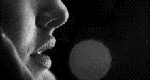 a black and white photo of a person 's face with dots on it