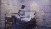 a woman in a straight jacket sits on a bed