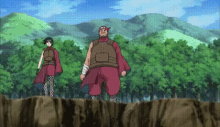 a man and a woman are standing in a forest
