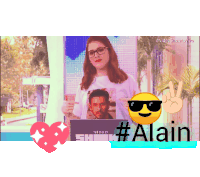 a woman wearing sunglasses is holding a picture of a man and the name alain is on the bottom