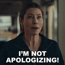 a woman says i 'm not apologizing in front of a black background