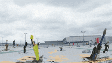a group of people are standing in a snowy area with a yellow object in the middle