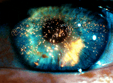 a close up of a person 's eye with a lot of sparks in it