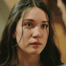 a woman with tears running down her face