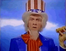 a man dressed as uncle sam is holding a banana