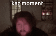 a blurred image of a person with the words kaz moment written above them