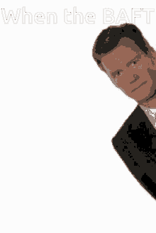 a man in a suit and tie with the words when the baft written above him .