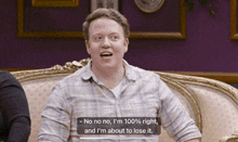 a man sitting on a couch with a caption that says no no no