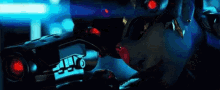 a close up of a person holding a gun with red lights .
