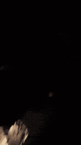 a dark background with smoke coming out of the corner
