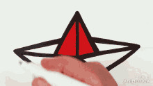 a person is drawing an origami boat with a marker and the words made in animatica are visible
