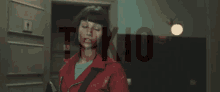 a woman in a red jacket is standing in front of a door with the word tokyo on it .