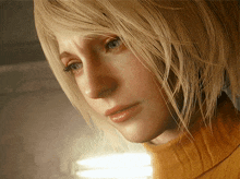 a close up of a woman 's face with a yellow sweater on