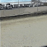 a drawing of a fence with cars parked behind it and the number 23 written on the bottom