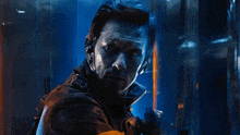 a man wearing a headset is behind a glass wall