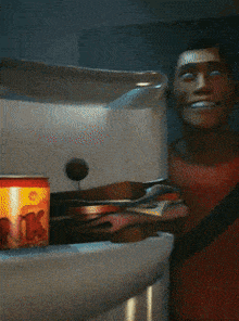 a man in a red shirt is smiling in front of a fridge