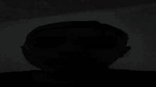 a man 's head is visible in the dark