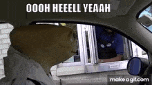 a man wearing a pig mask is driving a car and talking to a man at a drive through window .