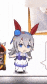 a cartoon girl with bunny ears is standing next to a jukebox .