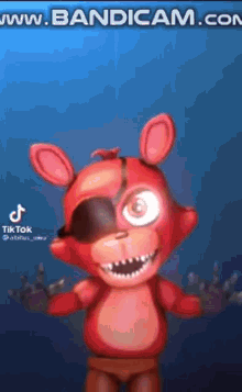 foxy from five nights at freddy 's is a red teddy bear with a black eye .