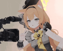a girl with a cat ear and gloves is standing in front of a camera