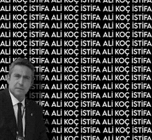 a man in a suit and tie is standing in front of a black background with a lot of words .