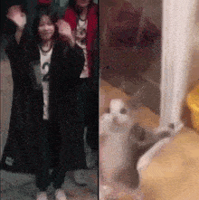 a woman in a long black coat is dancing next to a cat .