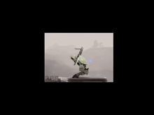 a robot is standing on top of a tower in the fog