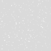 the snow is falling on a gray background .