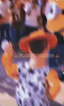 a blurry picture of a person wearing a hat with the letter c in the corner