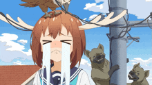 a girl crying with a bird on her head and a hyena behind her