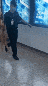 a man in a mask is walking a dog in a subway station