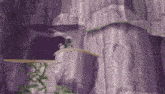 a cartoon drawing of a person standing on top of a purple cliff .