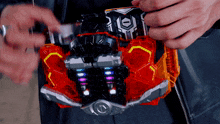 a person is holding a toy that has the number 1 on the front